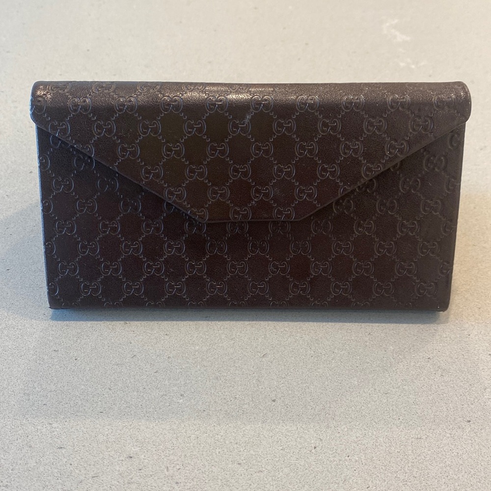 Gucci brown leather sunglasses case.